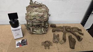 lot 26 image: OCPMulticam  Scorpion 3-day Assault Pack (Excellent condition), Blackhawk Drop Leg Holster set thigh holster Beretta M9 (excellent condition) and a WeatherTech CupFone