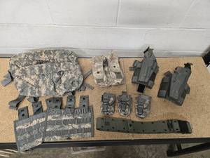 lot 28 image: 2 Left Hand Beretta M9 Drop Leg Holsters, 2 Waist packs, 2 Triple Mag Pouches, 1 Blackhawk S.T.R.I.K.E Gen IV Double Mag pouch (holds 6 mags), 3 Flashbang Pouches & 1 nylon adjustable Equipment Belt size Large (most items in excellent Condition)