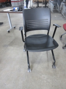 lot 656 image: KI  NESTING CHAIRS WITH ARMS AND WHEELS.