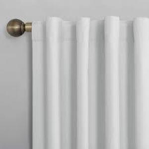 lot 105 image: Sun Zero Cyrus White Polyester Solid 40 in. W x 96 in. L Noise Cancelling Grommet Blackout Curtain