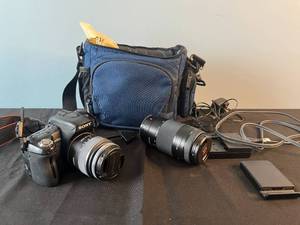 lot 51 image: Sony Alpha 500 DSLR Camera Bundle with Lens, Charger, and Carrying Case