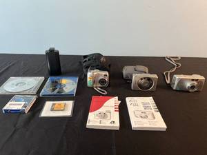 lot 52 image: Lot of Canon and Nikon Digital Cameras with Accessories