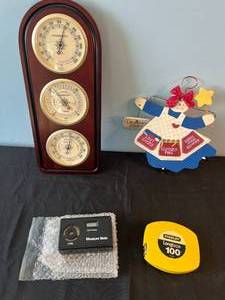 lot 55 image: Lot of Weather Station, ETEC Measure Mate, Stanley Long Tape, and Decorative Laundry Fairy