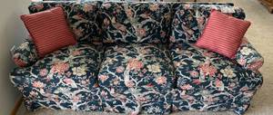 lot 76 image: Floral Upholstered Sofa with Red Accent Pillows