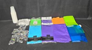lot 60 image: Assorted Party Supplies Table Covers, Cups, Utensils, and Drink Pouches