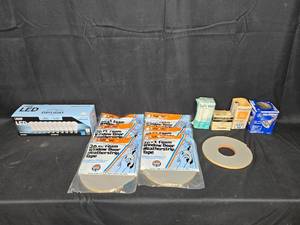 lot 77 image: Lot of Foam Weatherstrip Tape, LED Bulbs, and Halogen Bulbs