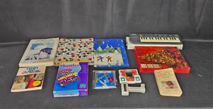 lot 136 image: Mixed Lot of Books, Games, and Casio Keyboard
