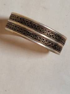 lot 72 image: Double Banded Coiled Brass and Silver Cuff Bracelet