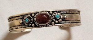 lot 75 image: Ornate Silver Cuff Bracelet with Carnelian Center Stone and Turquoise Points