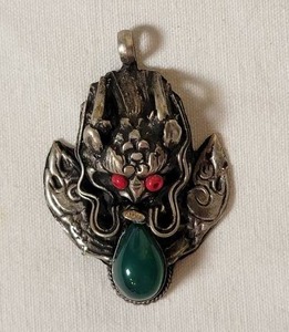lot 77 image: Silver Dragon Head Pendant with Jade Teardrop