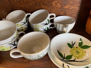 Assorted glassware, plates, orange pitcher