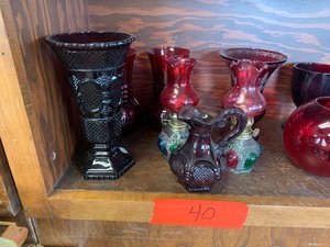 Red glassware, albums and reading material
