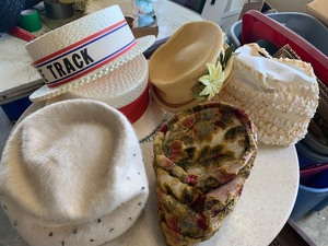 Wesson tin full of vintage hats