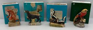 lot 75 image: Vintage Misc. Ski Country Miniature Collectible Decanters In Original Boxes Including Lookout Indian, Skunk Family & More (EMPTY)