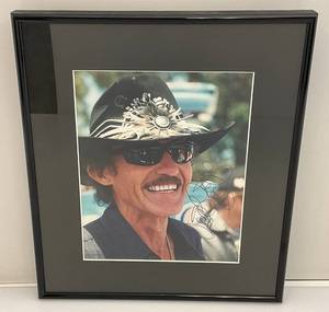 lot 94 image: Treadways Authentic Autographs (Richard Petty) Autographed Photo With COA Framed Behind Glass 12 14 x 14 14