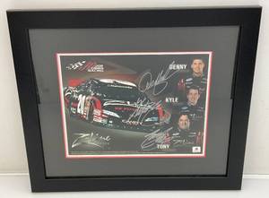 lot 96 image: Global Authentics  Joe Gibbs Racing (Denny Hamlin, Kyle Busch & Tony Stewart) Autographed Photo With COA Framed Behind Glass 14 34 x 17 14