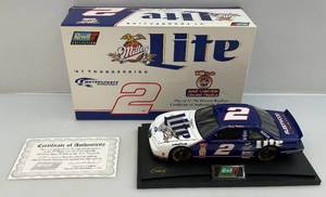 lot 98 image: Miller High Lite 118 Scale Diecast Car Revell Collection Rusty Wallace #2 With COA (NIB)