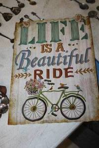 lot 1569 image: Life Is a Beautiful Ride logo Bicycle theme Metal Sign
