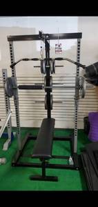 lot 34 image: Iron Master Smith Machine ( Comes with  500lb weight plates)