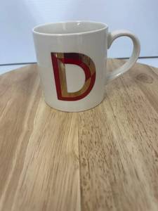 Mug With An Artistic Letter D  Approximately 8 Pieces 