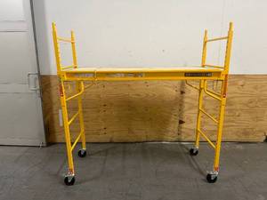 lot 95 image: MetalTech Baker Adjustable Steel Platform Jobsite Series 6 Feet Tall Mobile Scaffolding Ladder with Locking Caster Wheels, Yellow- Scratch and Dent