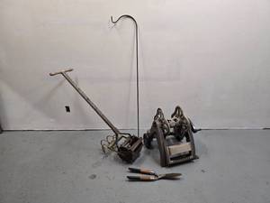 lot 3 image: Hose reel - vintage push garden cultivator  plow - hedge shears -  5 shepherds hook