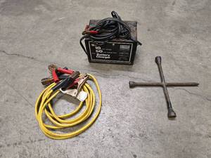 lot 6 image: Sears 12 V Battery Charger -  12 ft jumper cables - 1 - 13 4-way lug wrench
