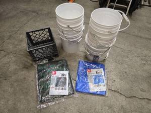 lot 25 image: 2 Tarps (1- camo medium duty 11 4 x 15 6 and 1-blue light duty 56 x 76), plastic crate and 8 white buckets with handles