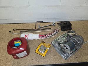 lot 28 image: GE Motor, container of fuses, transformer for bells, buzzers, chimes and door openers, a bunch of misc wires and other misc items