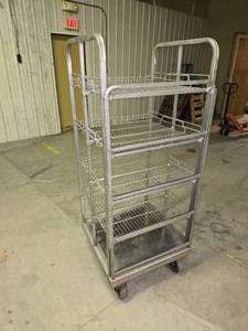 lot 35 image: 5 12 ft tall stainless steel rolling rack (several of the wheels are locked up so it doesnt roll well)