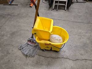 lot 45 image: Rubbermaid Commercial mop bucket and wringer combo on wheels (missing 1 wheel), 1 mop and 1 replacement mop head