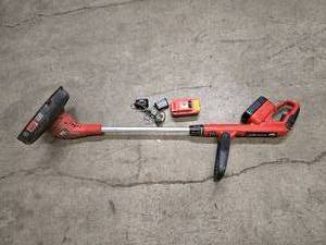lot 46 image: Black and Decker cordless  battery operated weed eater  trimmer - includes battery and charger