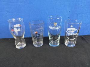 lot 107 image: Collection of 4 Drinking Glasses Guinness, Finnegans, and Others