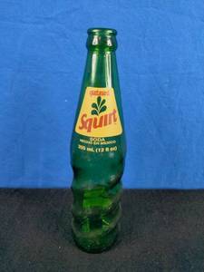 lot 118 image: One Vintage Squirt Soda Bottle