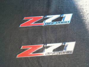 lot 132 image: Two Chevy or GMC Z71 Badges