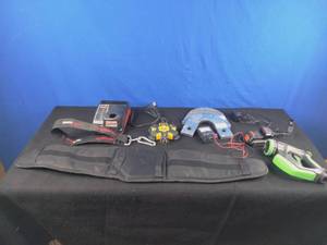 lot 137 image: Assorted Garage Items Multimeter, Battery Charger, Back Brace, Etc.