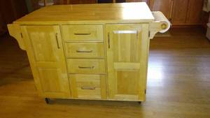 Kitchen Island with caster wheels.