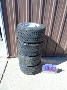 Qty of 4 golf cart tires & wheels. Good condition. As shown.