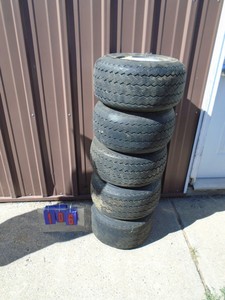 Qty of 5 golf cart tires & wheels. Used condition. As shown.