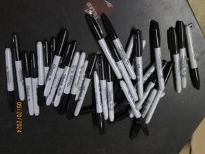 lot 64 image: lot of black sharpies...
