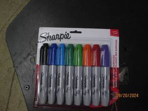 lot 94 image: package of sharpies...