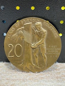 lot 47 image: Vintage Goodyear Tires 20 Years of Friendly Service Medallion