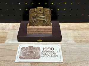 lot 62 image: John Deere Brass Calendar 1990