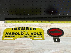 lot 72 image: Vtg State Farm & Insured Harold J Volz License Plate Topper