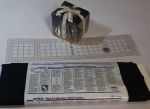 lot 39 image: HTC Armo Weft Fusible Interfacing Black, Creative Grids Turn-A-Round 1983 Template, Moda Stack of Fats