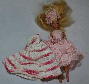 lot 51 image: 1966 Mattel Fashion Barbie Doll Blonde Hair Pink Ruffled Gown and Crocheted Dress, Malaysia