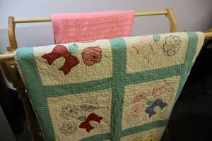 lot 76 image: Vintage Hand-Sewn Floral Patchwork Quilt and Pink Crocheted Baby Blanket