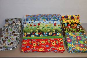lot 126 image: Assorted Childrens Soft Flannel Fabrics Jungle, Dr. Seuss, Debbie Mumm, Sports Etc. Baby Blankets, Bibs, Doll Clothes Etc