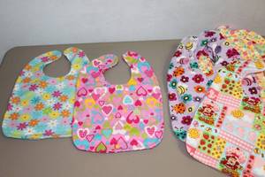 lot 129 image: (22) Baby Bibs, Project Near Completion,,,Includes Original Pattern by Betsy, Mini Steam Iron and Scissors