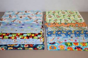 lot 131 image: Assorted Childrens Soft Flannel Fabrics Cut, Pre-Washed and Ready for More Bibs, Doll Clothes Etc